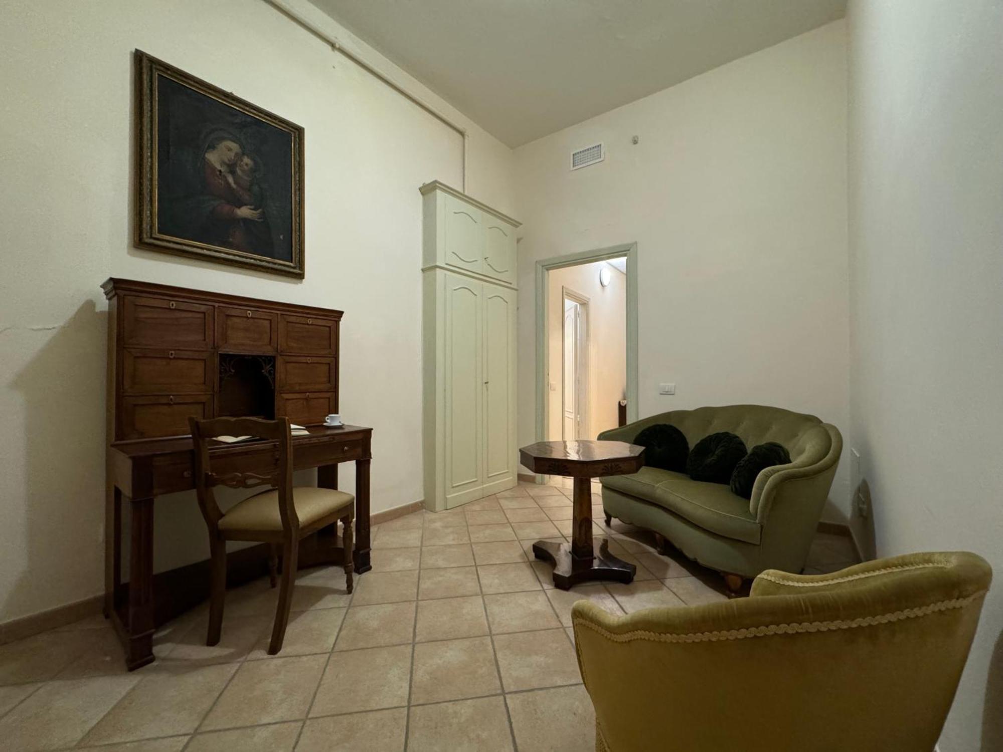 Monastero Ss. Annunziata Hotel Todi Eksteriør billede The living room of the apartment